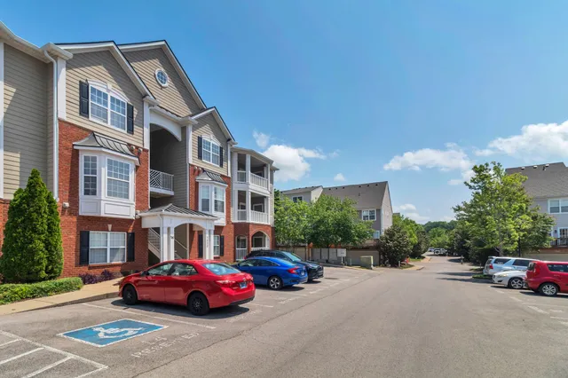a front view of a building with parking space