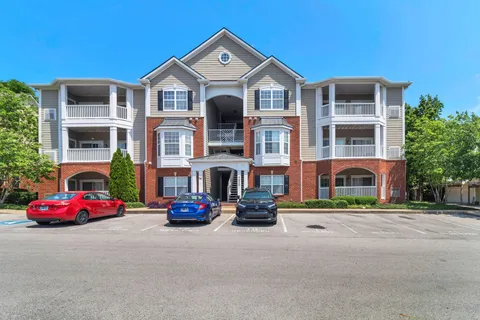 a car parked in front of a brick building