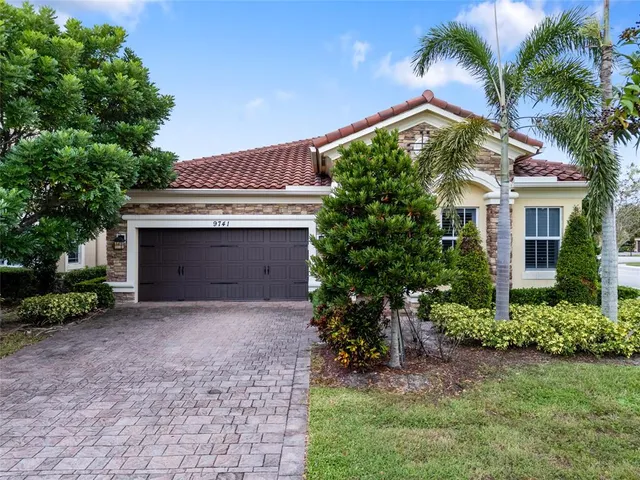 front view of a house with a garden