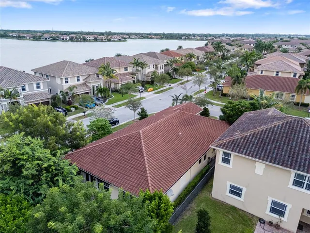 an aerial view of multiple house with a garden