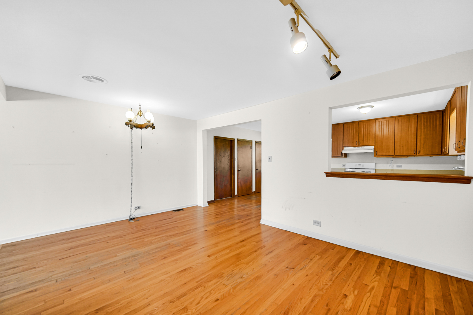 18422 Clyde Road Homewood, IL 60430 - Photo 8 of 29 a view of an empty room with wooden floor and a window
