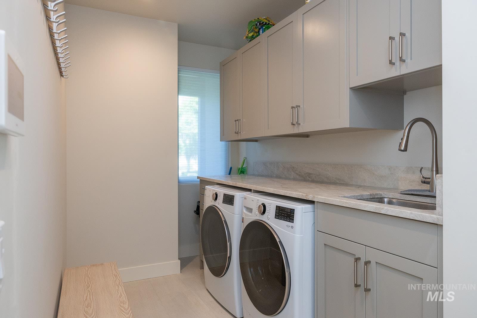 27 Streamside Drive Hailey, ID 83333 - Photo 28 of 39 Washroom with independent washer and dryer and cabinet space