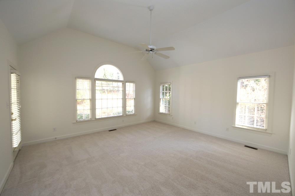 4428 Touchstone Forest Road Raleigh, NC 27612 - Photo 10 of 21 Master bedroom with vaulted ceiling and palladium window.