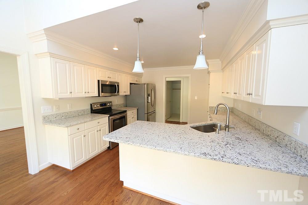 4428 Touchstone Forest Road Raleigh, NC 27612 - Photo 7 of 21 New granite countertops and stainless steel appliances