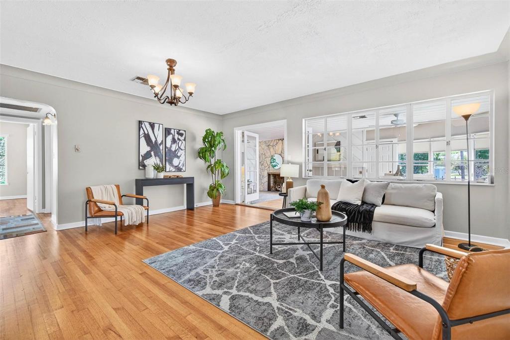 300 22nd Avenue South St. Petersburg, FL 33705 - Photo 13 of 82 a living room with fireplace furniture and a wooden floor
