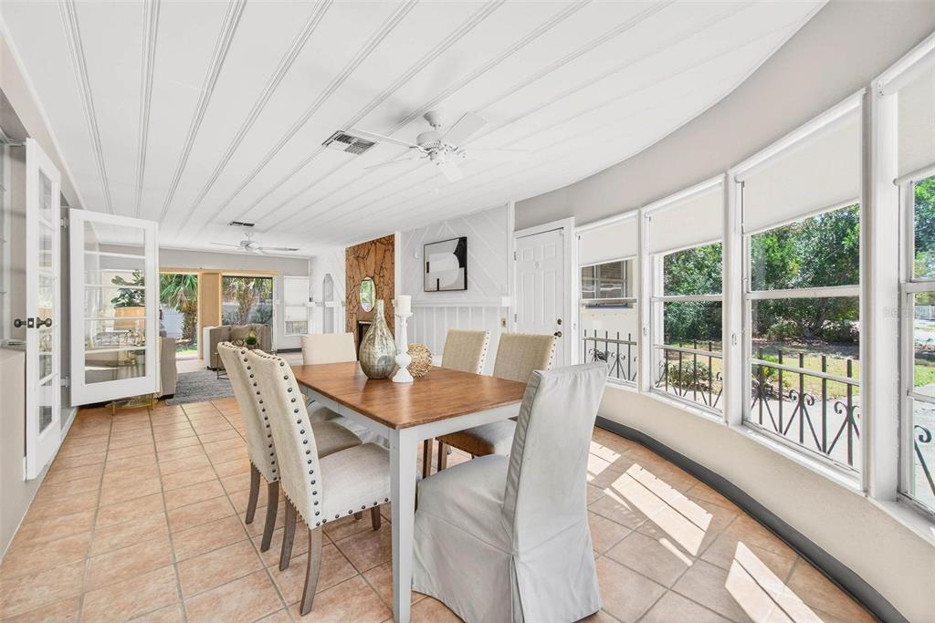 300 22nd Avenue South St. Petersburg, FL 33705 - Photo 16 of 82 a view of a dining room with furniture window and outside view