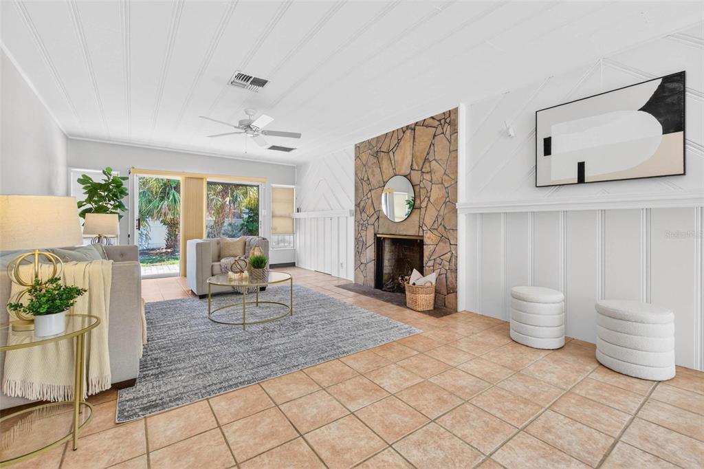 300 22nd Avenue South St. Petersburg, FL 33705 - Photo 17 of 82 a living room with furniture a window and a fireplace