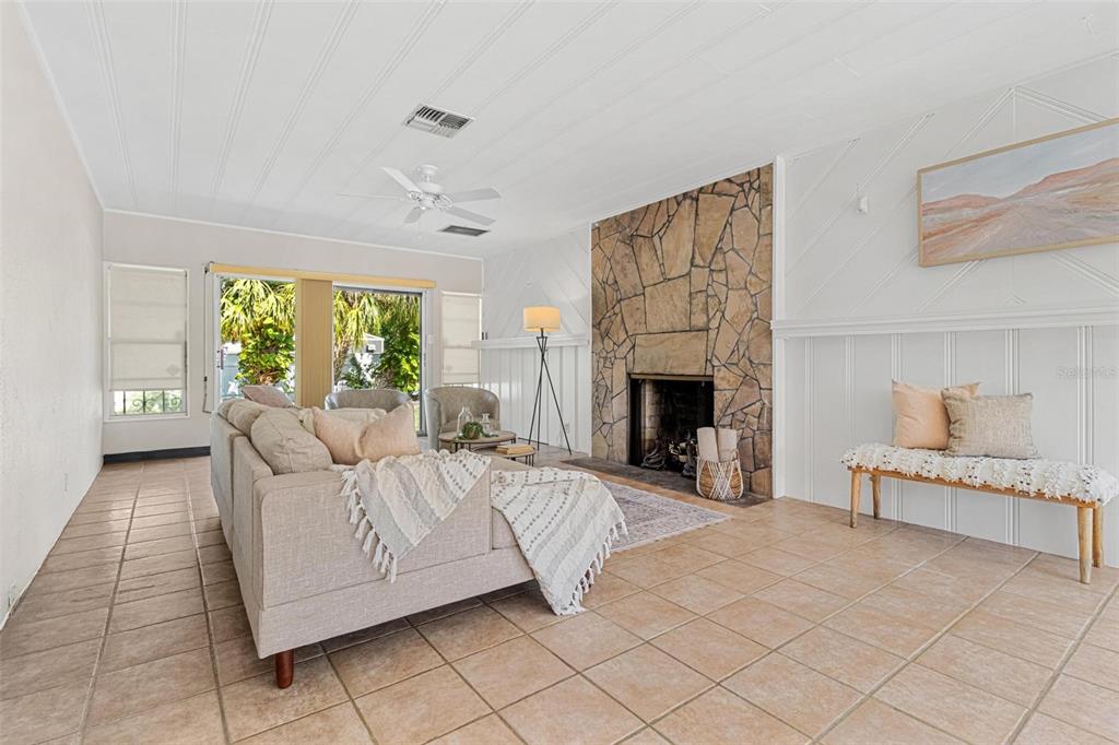 300 22nd Avenue South St. Petersburg, FL 33705 - Photo 31 of 82 a living room with furniture and a fireplace