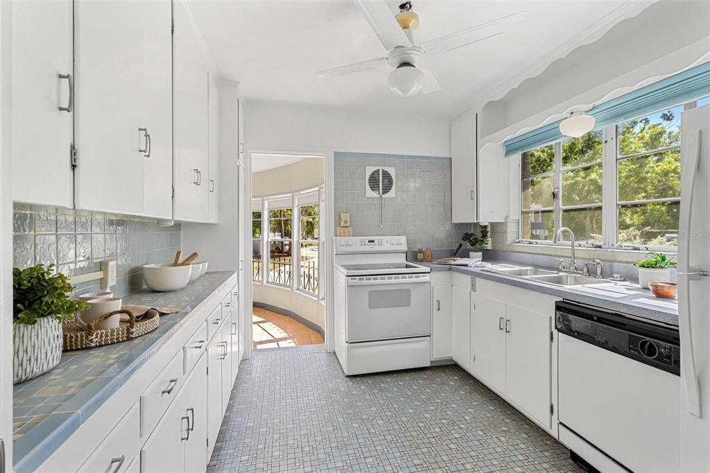 300 22nd Avenue South St. Petersburg, FL 33705 - Photo 40 of 82 a kitchen with a sink stove and cabinets