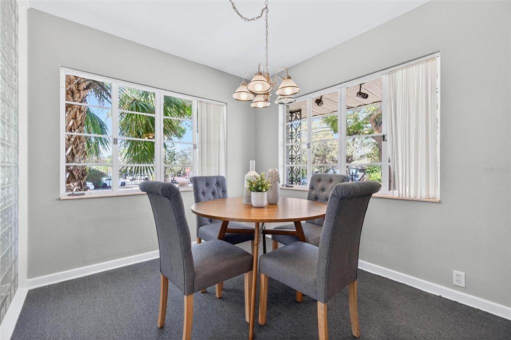 300 22nd Avenue South St. Petersburg, FL 33705 - Photo 45 of 82 a view of a dining room with furniture window and outside view
