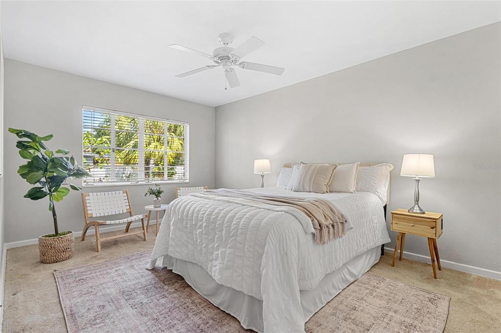 300 22nd Avenue South St. Petersburg, FL 33705 - Photo 47 of 82 a bedroom with a bed and a chandelier