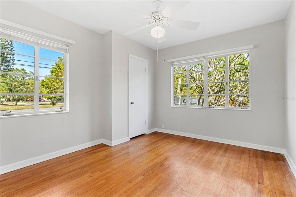300 22nd Avenue South St. Petersburg, FL 33705 - Photo 49 of 82 a view of an empty room with wooden floor and a window