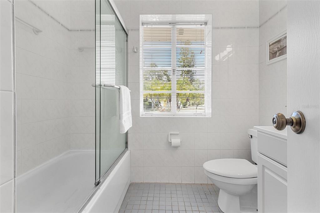 300 22nd Avenue South St. Petersburg, FL 33705 - Photo 50 of 82 a bathroom with a toilet and a shower