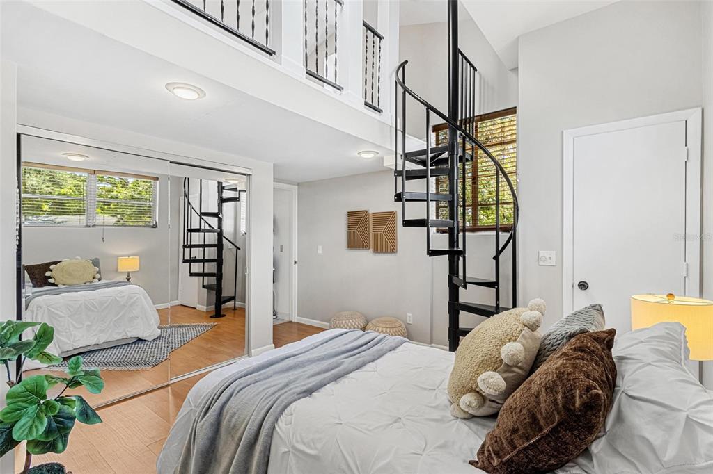 300 22nd Avenue South St. Petersburg, FL 33705 - Photo 52 of 82 a bedroom with a bed couch and a window