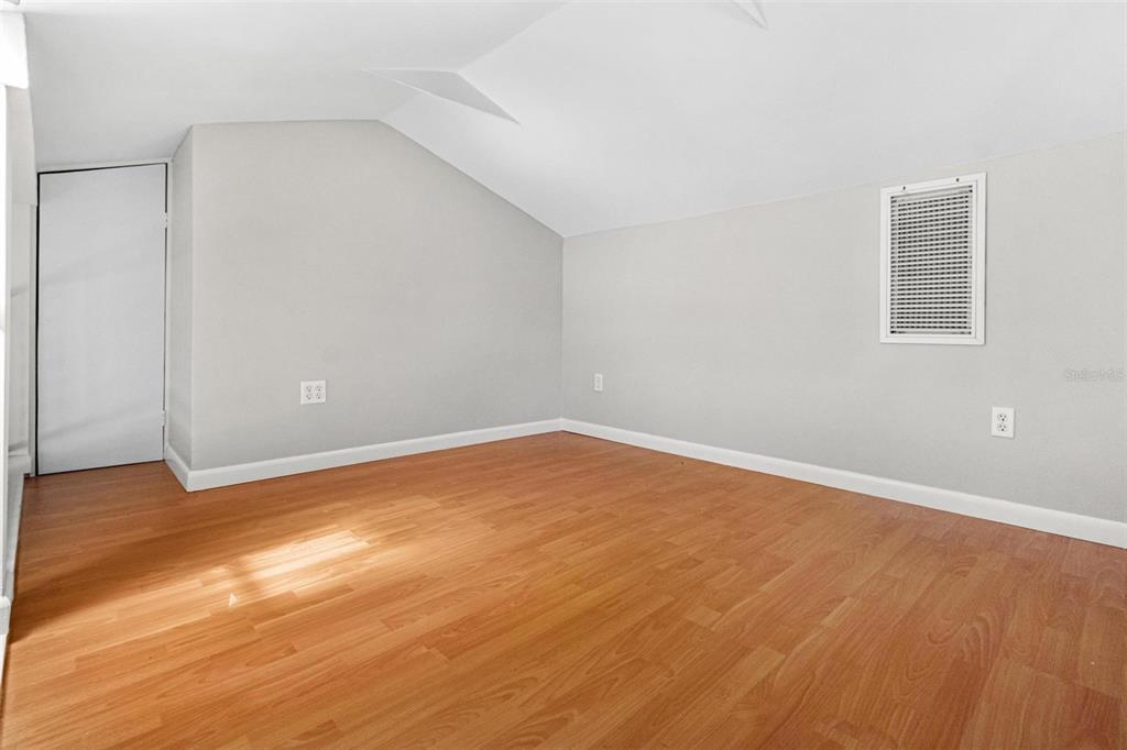 300 22nd Avenue South St. Petersburg, FL 33705 - Photo 54 of 82 a view of an empty room with wooden floor and a window