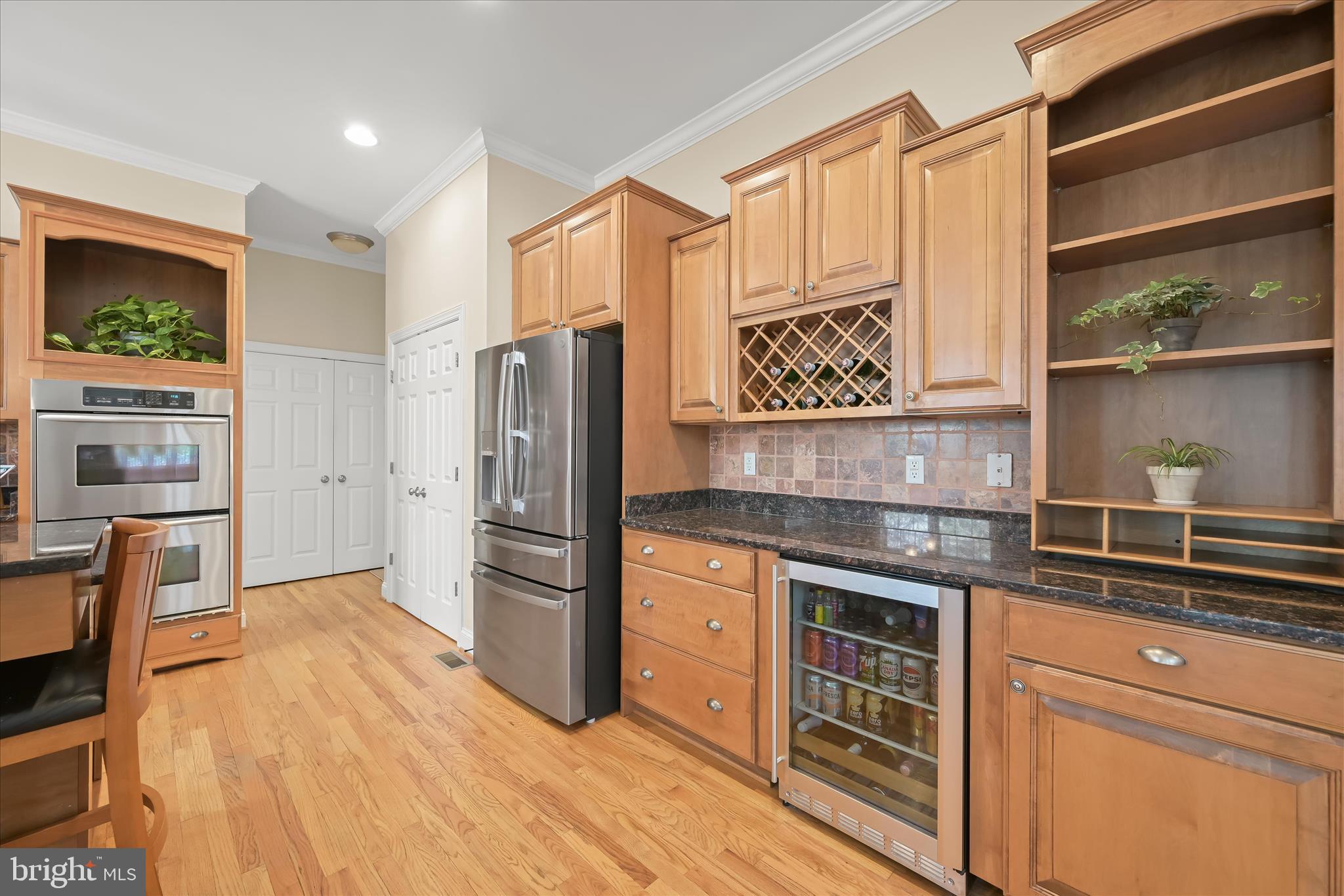 7016 Meandering Stream Way Fulton, MD 20759 - Photo 19 of 86 a kitchen with stainless steel appliances granite countertop a refrigerator and a stove top oven