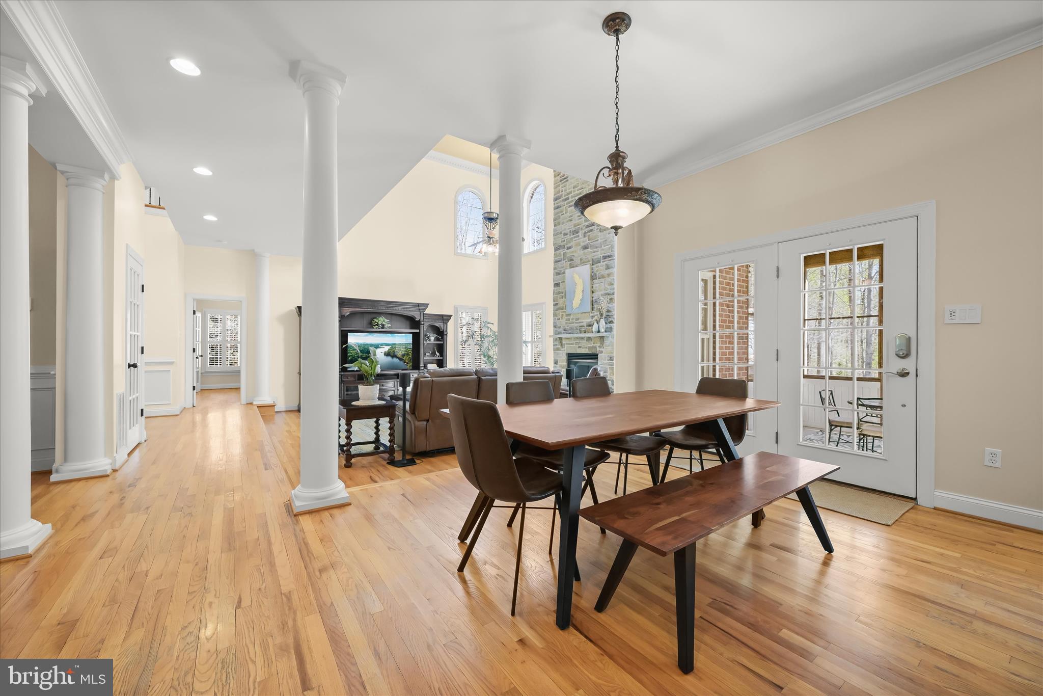 7016 Meandering Stream Way Fulton, MD 20759 - Photo 24 of 86 a view of a dining room with furniture window and wooden floor