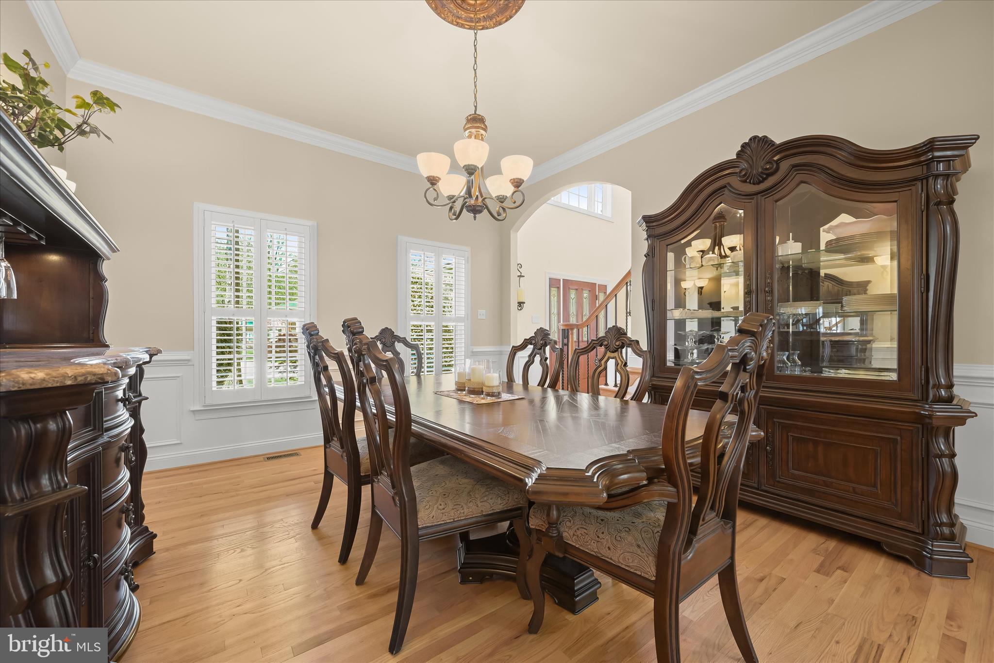 7016 Meandering Stream Way Fulton, MD 20759 - Photo 29 of 86 a view of a dining room with furniture window and wooden floor
