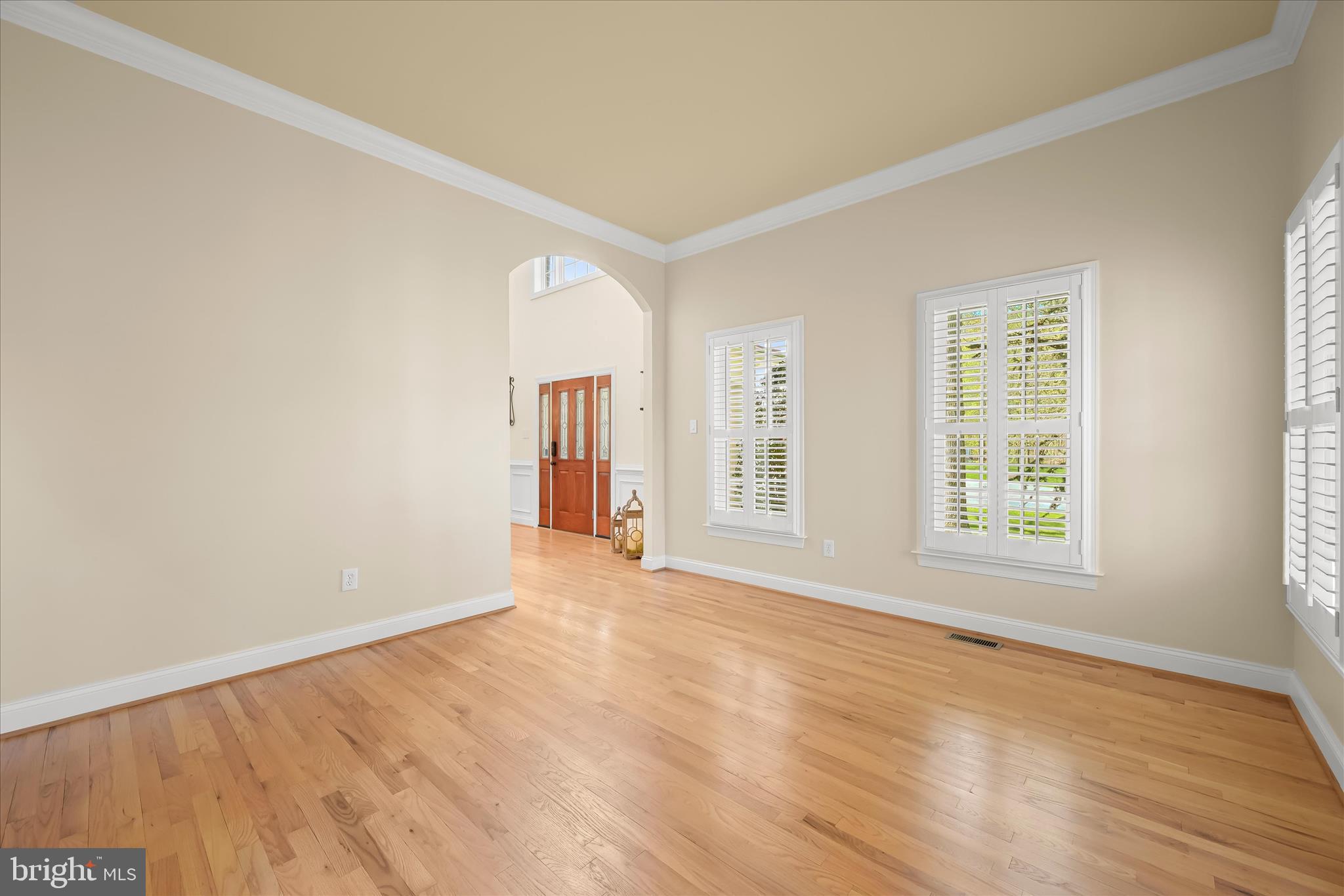 7016 Meandering Stream Way Fulton, MD 20759 - Photo 35 of 86 a view of an empty room with wooden floor and a window