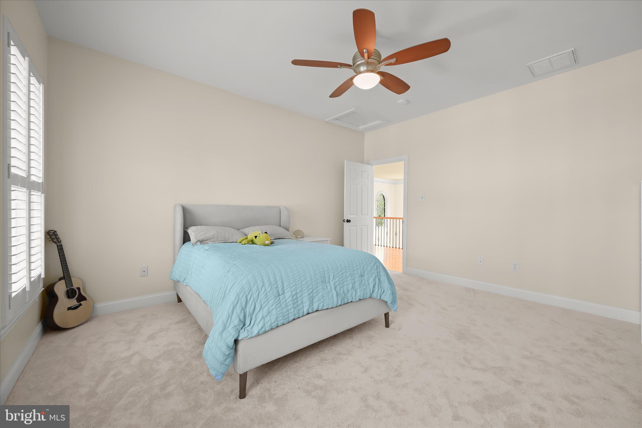 7016 Meandering Stream Way Fulton, MD 20759 - Photo 51 of 86 a bedroom with a bed and a ceiling fan