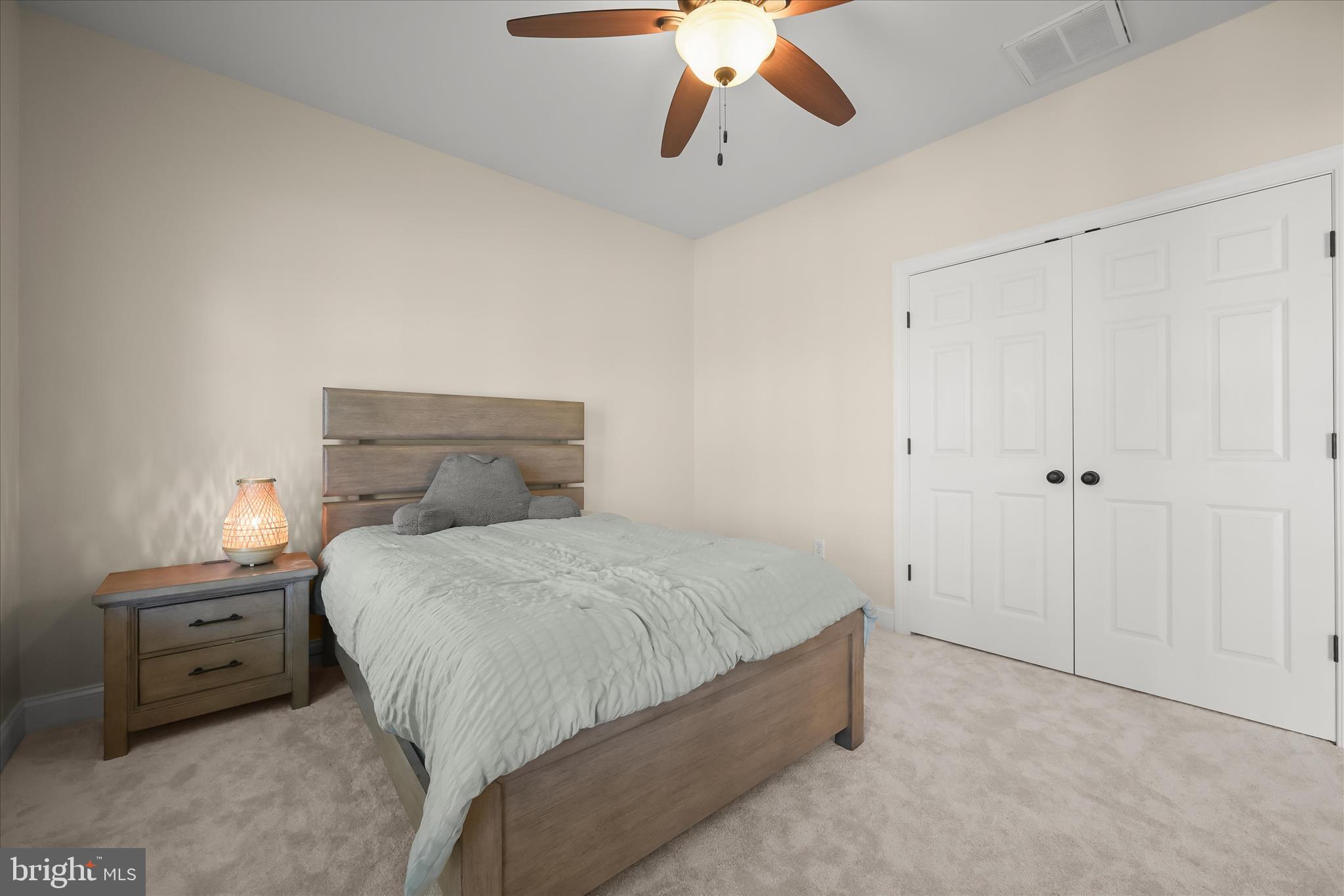7016 Meandering Stream Way Fulton, MD 20759 - Photo 56 of 86 a bedroom with a bed and a chandelier