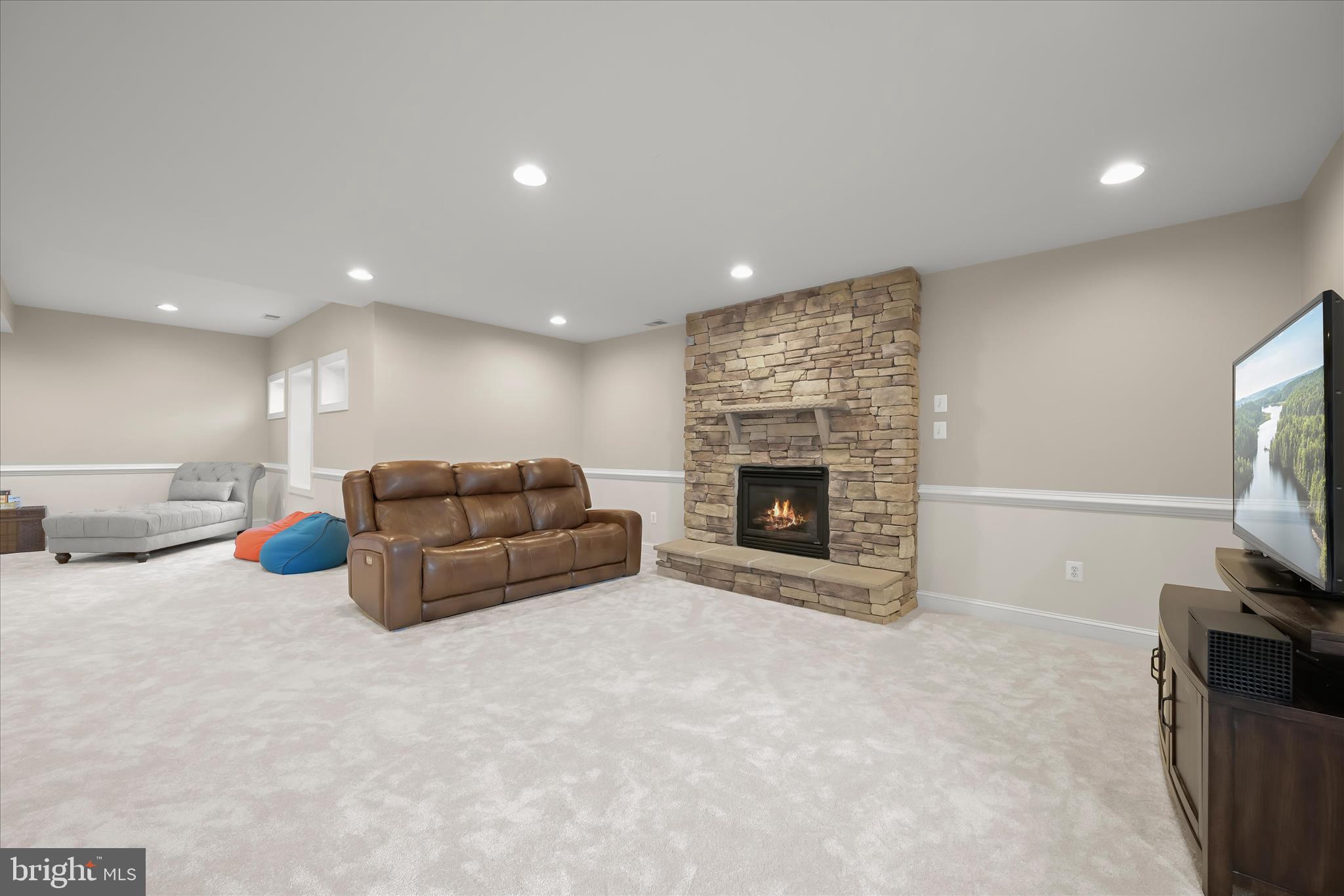 7016 Meandering Stream Way Fulton, MD 20759 - Photo 61 of 86 a living room with furniture and a fireplace