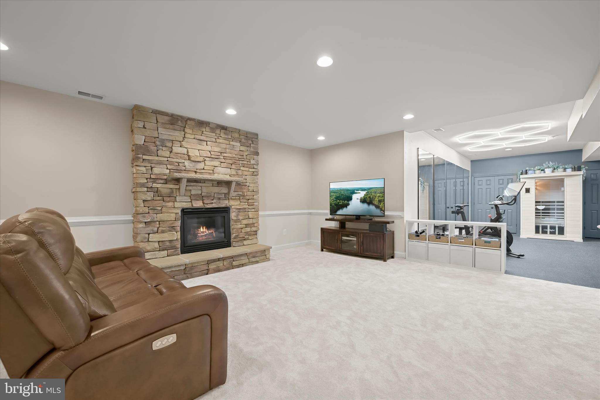 7016 Meandering Stream Way Fulton, MD 20759 - Photo 62 of 86 recreation room with gas fireplace
