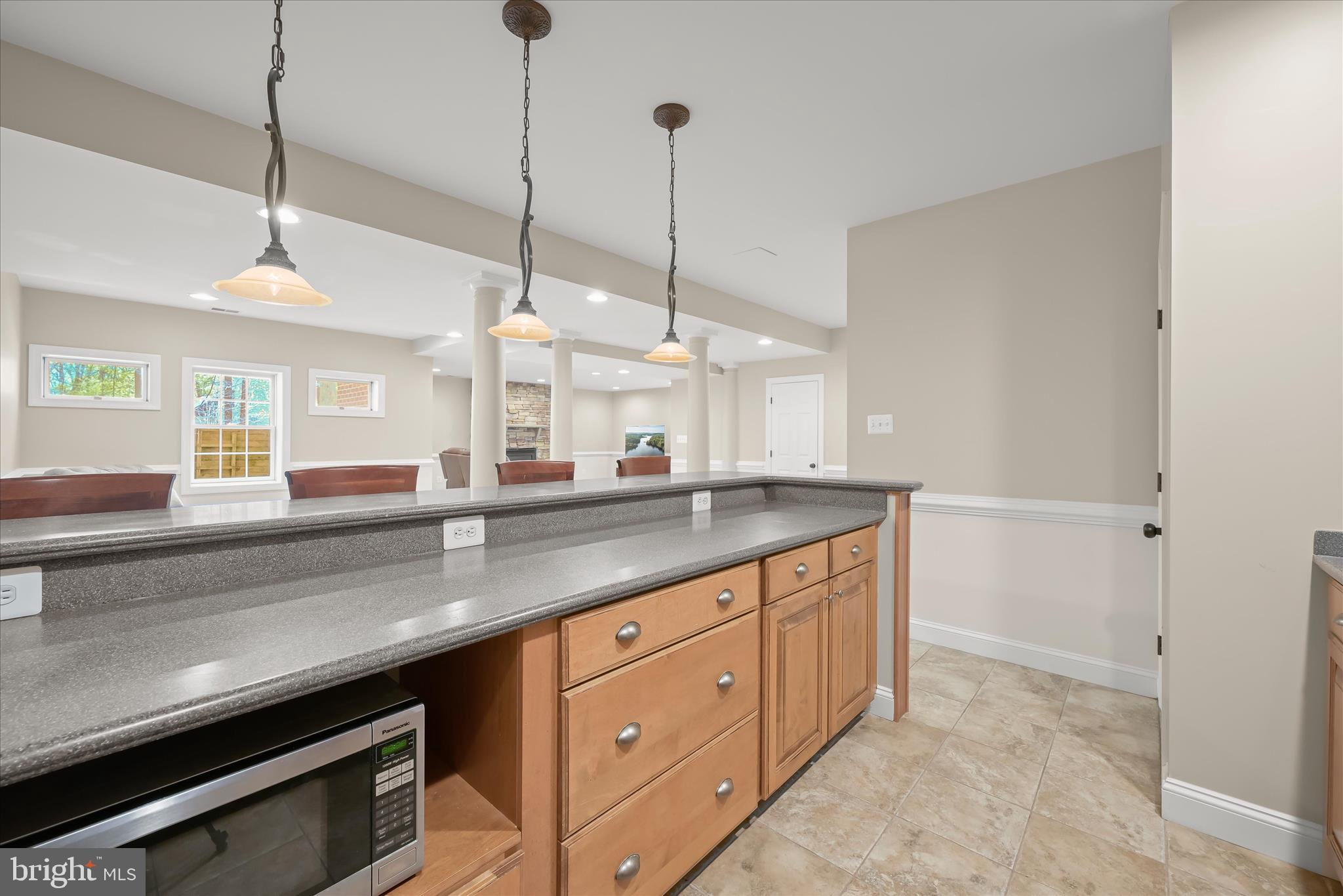 7016 Meandering Stream Way Fulton, MD 20759 - Photo 65 of 86 a kitchen with stainless steel appliances granite countertop a sink a counter space and cabinets