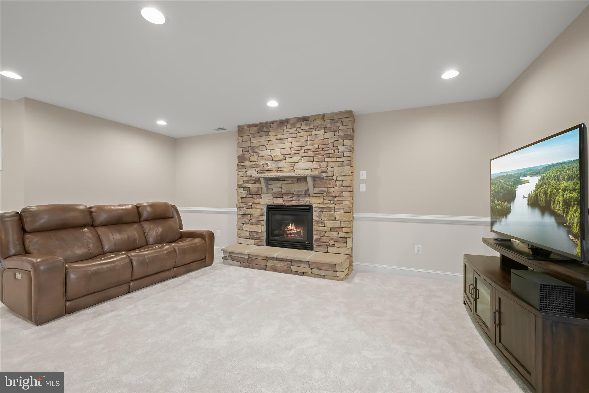 7016 Meandering Stream Way Fulton, MD 20759 - Photo 69 of 86 a living room with furniture and a flat screen tv