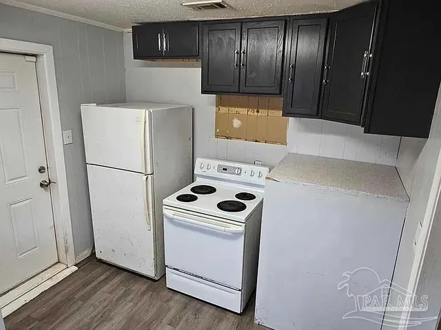 a kitchen with a refrigerator sink and stove