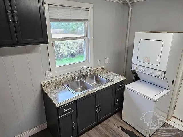 a utility room with a sink a washer and dryer