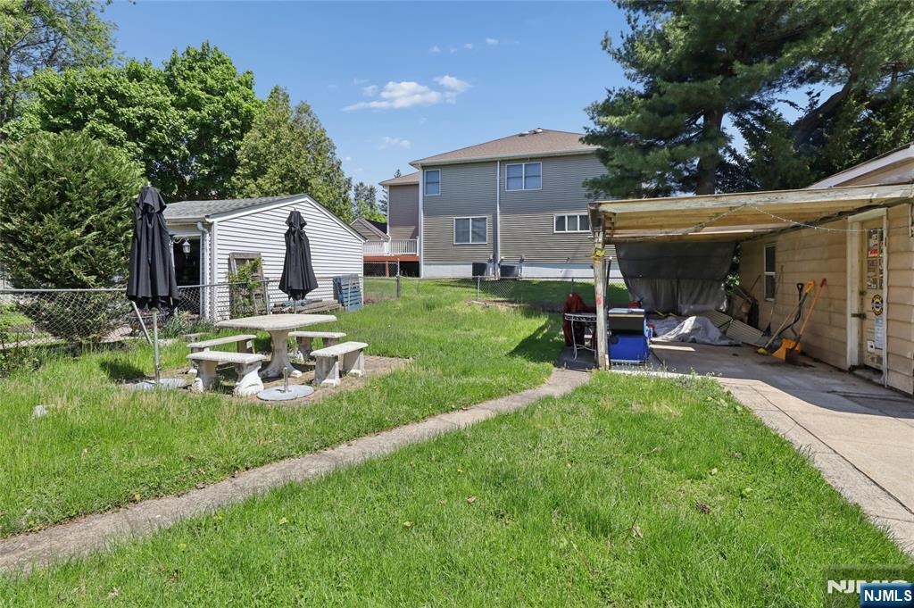 360 Rutherford Boulevard Clifton, NJ 07014 - Photo 11 of 42 a front view of house with yard and green space