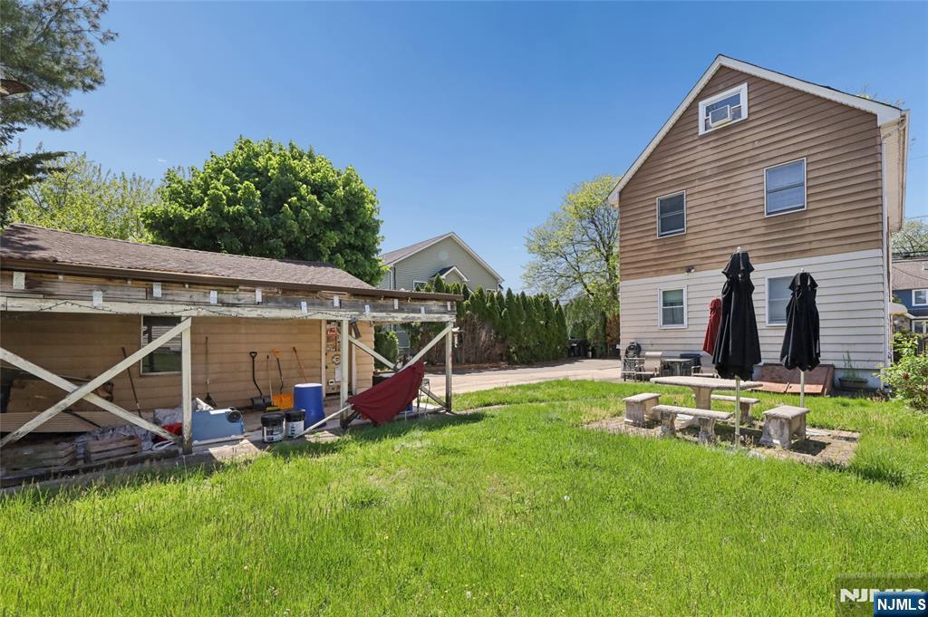 360 Rutherford Boulevard Clifton, NJ 07014 - Photo 12 of 42 a view of a house with backyard and a slide