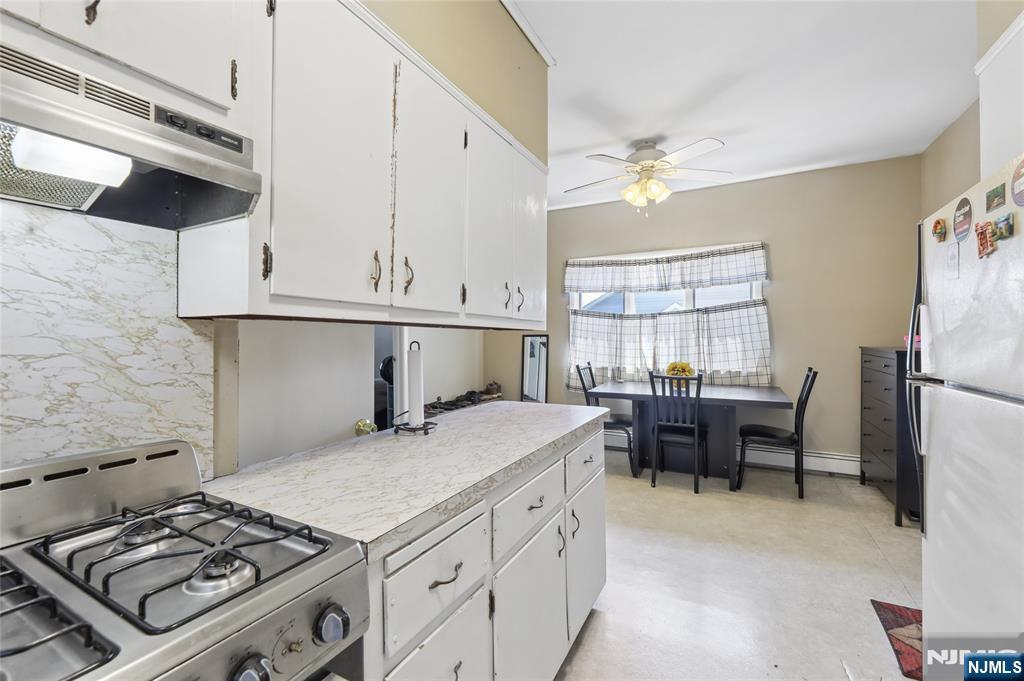 360 Rutherford Boulevard Clifton, NJ 07014 - Photo 13 of 42 a kitchen with a stove and a window