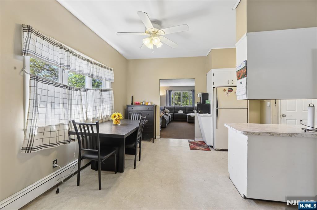 360 Rutherford Boulevard Clifton, NJ 07014 - Photo 15 of 42 a view of a dining room with furniture and a chandelier