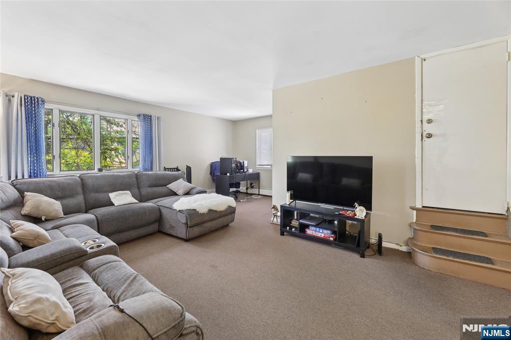 360 Rutherford Boulevard Clifton, NJ 07014 - Photo 19 of 42 a living room with furniture and a flat screen tv
