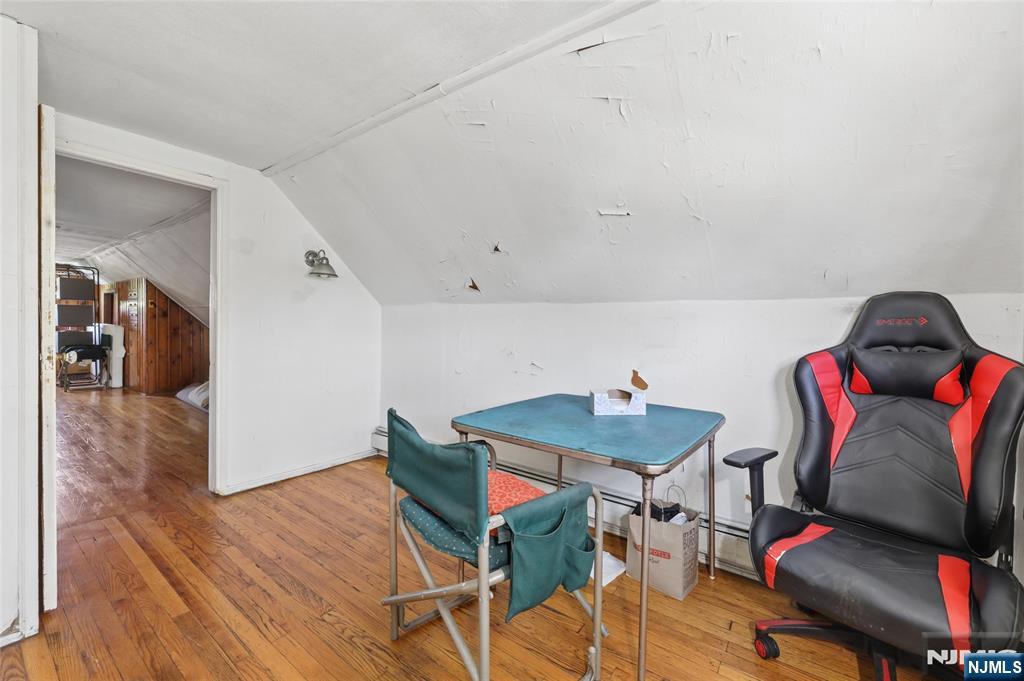 360 Rutherford Boulevard Clifton, NJ 07014 - Photo 20 of 42 a room with furniture and wooden floor