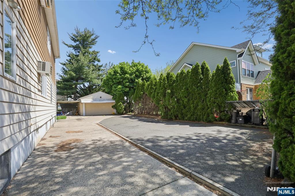 360 Rutherford Boulevard Clifton, NJ 07014 - Photo 2 of 42 a view of a house with a yard and plants