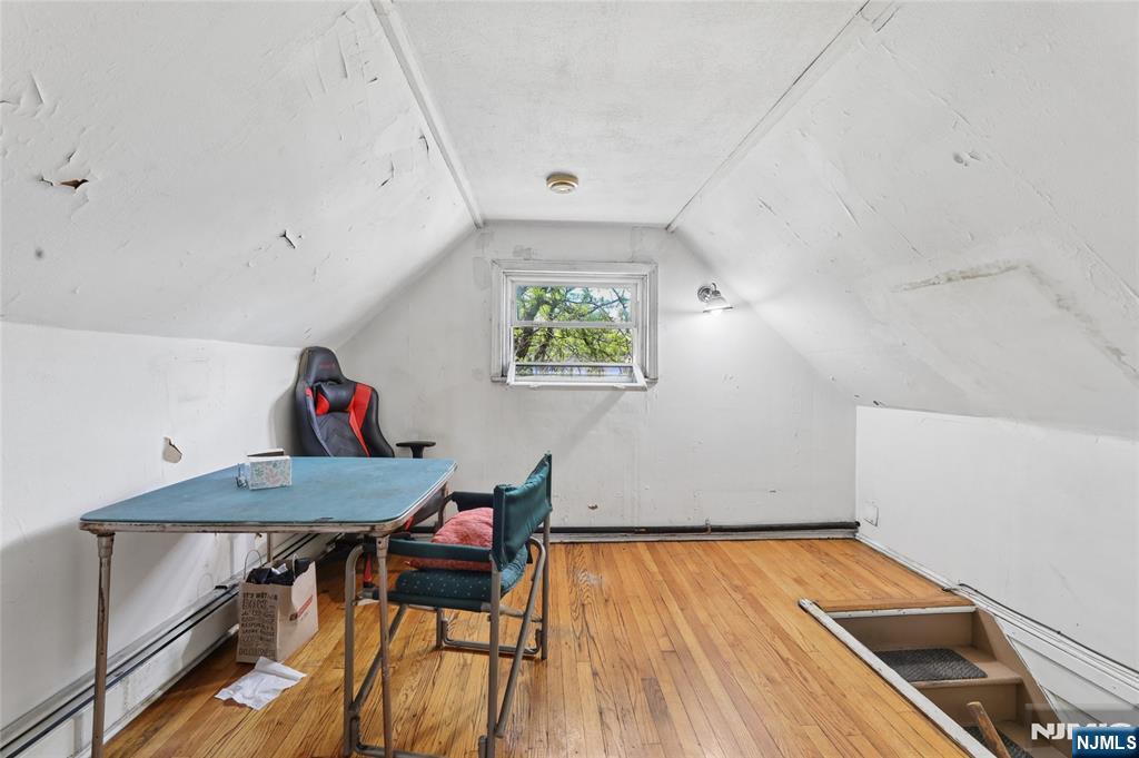 360 Rutherford Boulevard Clifton, NJ 07014 - Photo 21 of 42 a room with furniture and wooden floor