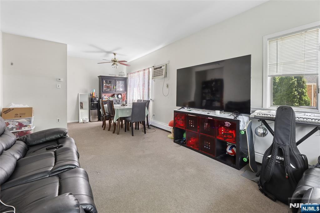 360 Rutherford Boulevard Clifton, NJ 07014 - Photo 25 of 42 a view of a livingroom with furniture and a flat screen tv