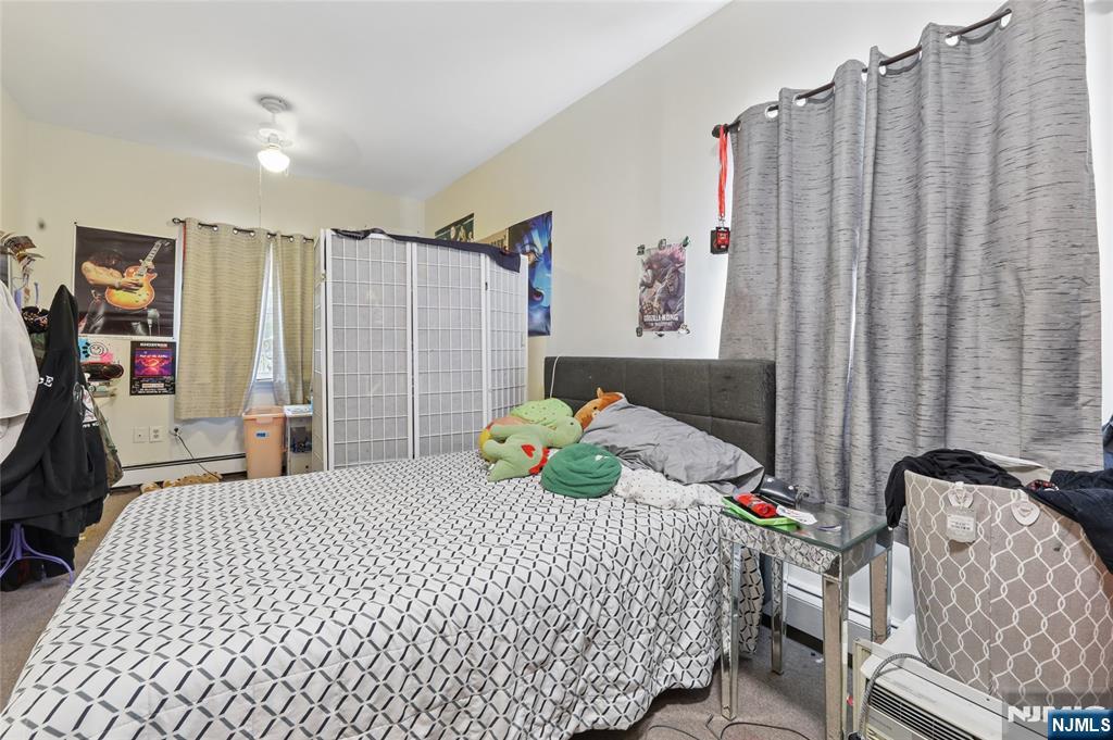 360 Rutherford Boulevard Clifton, NJ 07014 - Photo 34 of 42 a bedroom with a bed and a bed