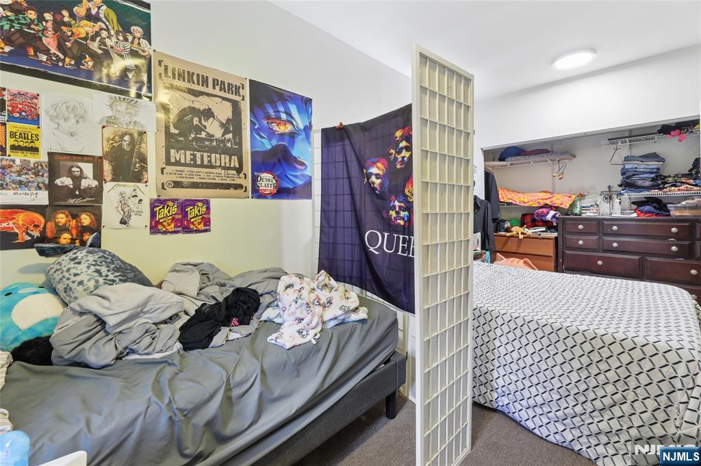 360 Rutherford Boulevard Clifton, NJ 07014 - Photo 35 of 42 a bedroom with bed and dresser