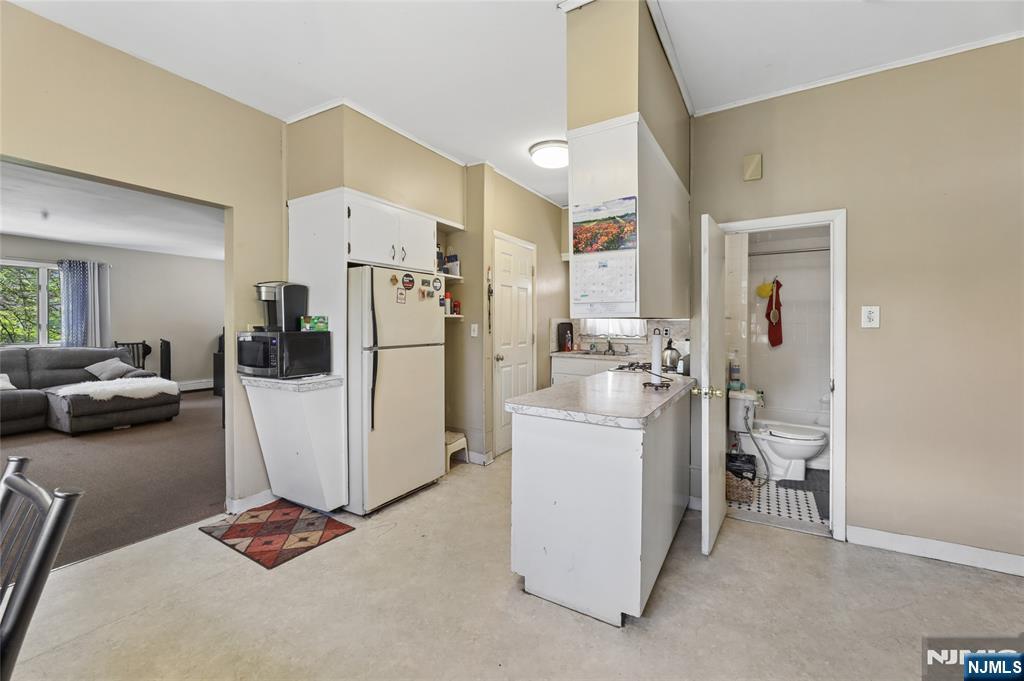 360 Rutherford Boulevard Clifton, NJ 07014 - Photo 37 of 42 a kitchen with a refrigerator and a stove