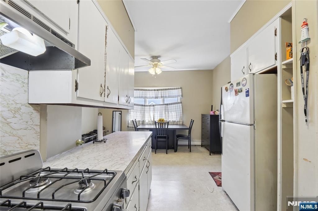 360 Rutherford Boulevard Clifton, NJ 07014 - Photo 38 of 42 a kitchen with stainless steel appliances granite countertop a sink stove and refrigerator