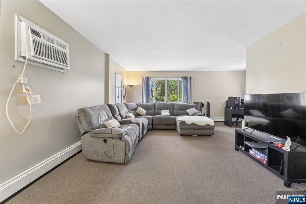 360 Rutherford Boulevard Clifton, NJ 07014 - Photo 4 of 42 a living room with furniture a couch and a window