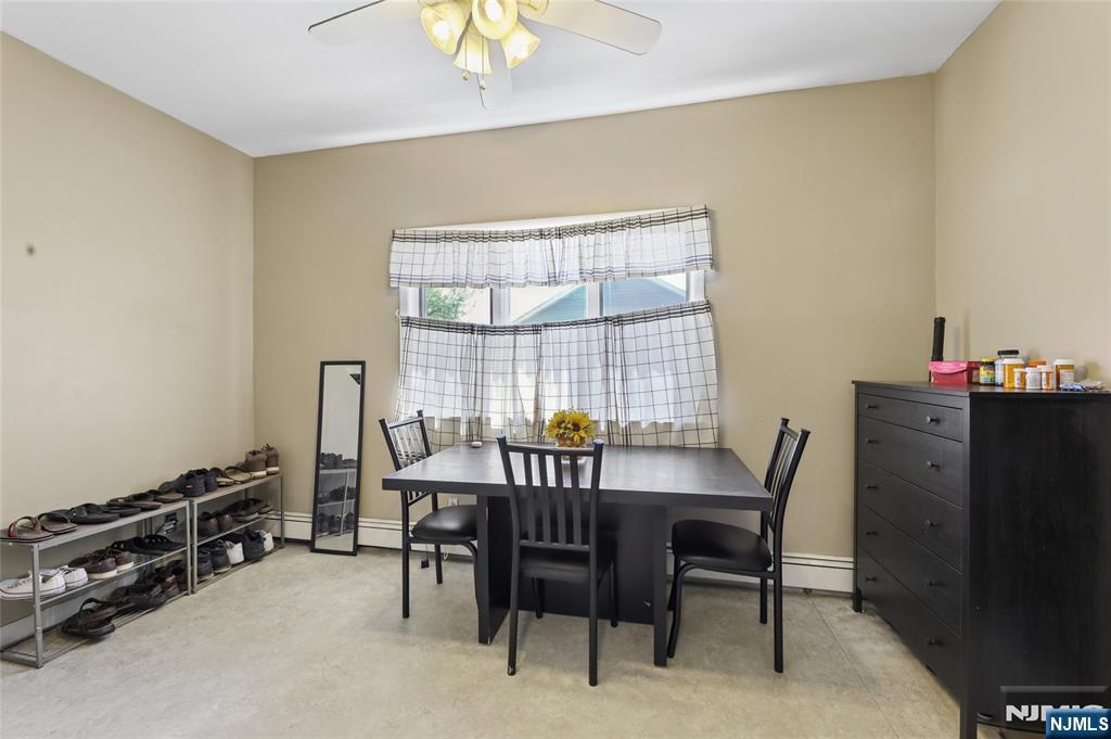 360 Rutherford Boulevard Clifton, NJ 07014 - Photo 41 of 42 a view of a dining room with furniture and a window