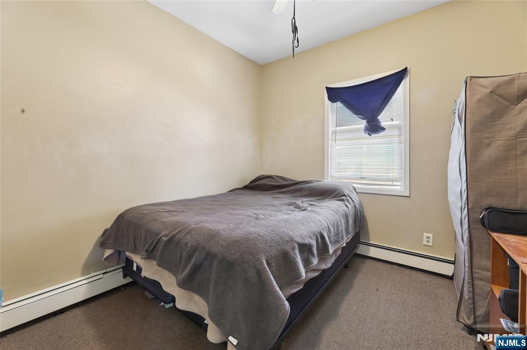 360 Rutherford Boulevard Clifton, NJ 07014 - Photo 5 of 42 a bedroom with a bed and a window