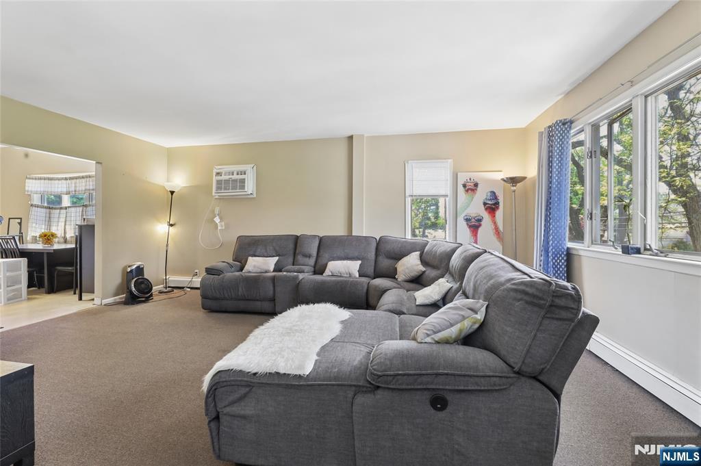 360 Rutherford Boulevard Clifton, NJ 07014 - Photo 7 of 42 a living room with furniture and a large window