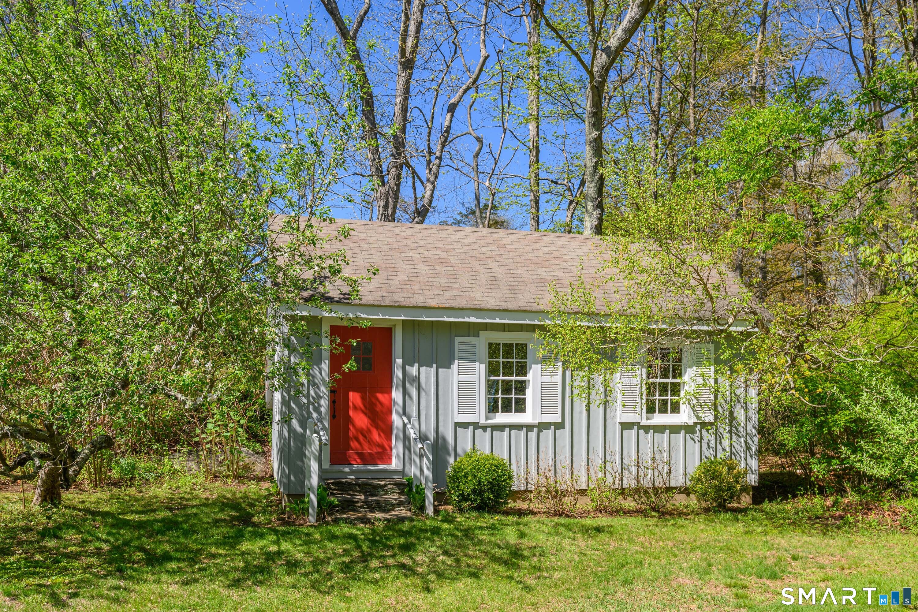 6 High Rock Road Newtown, CT 06482 - Photo 30 of 40 a view of a house with a small yard and a large tree