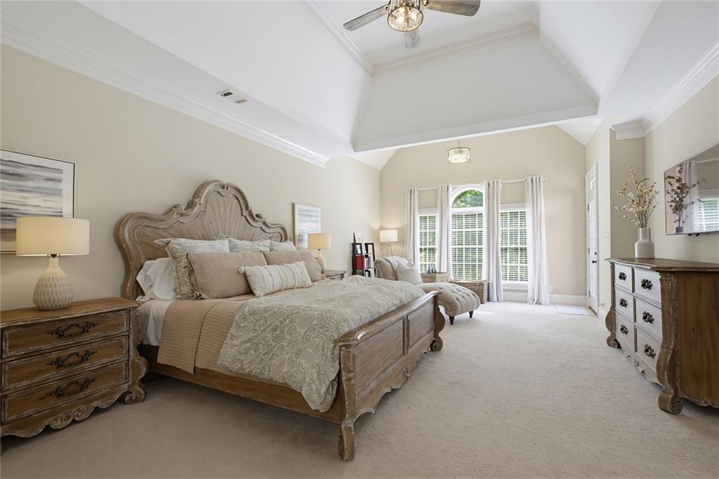 14442 Club Circle Milton, GA 30004 - Photo 27 of 82 a spacious bedroom with a bed a table and large window